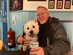 mike russell and his dog enjoying a pint